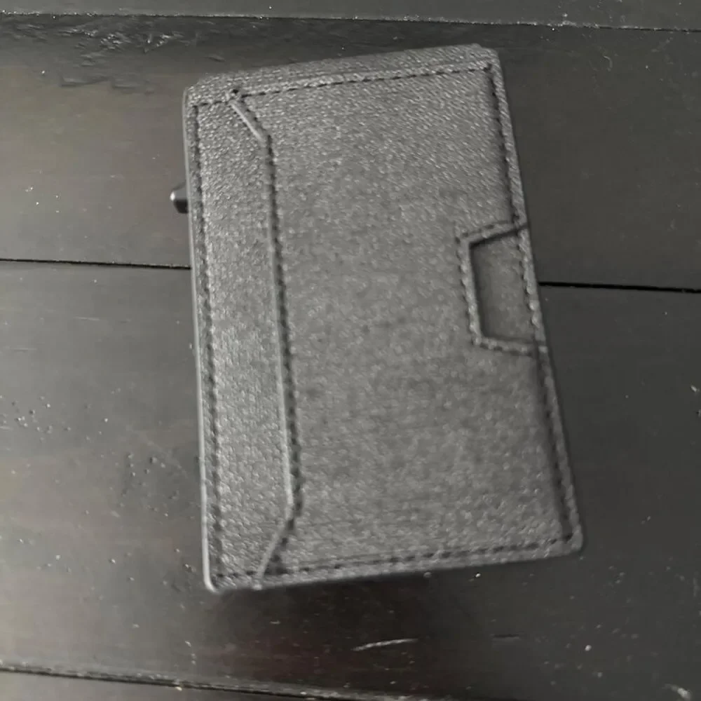 Black leather wallet with textured surface